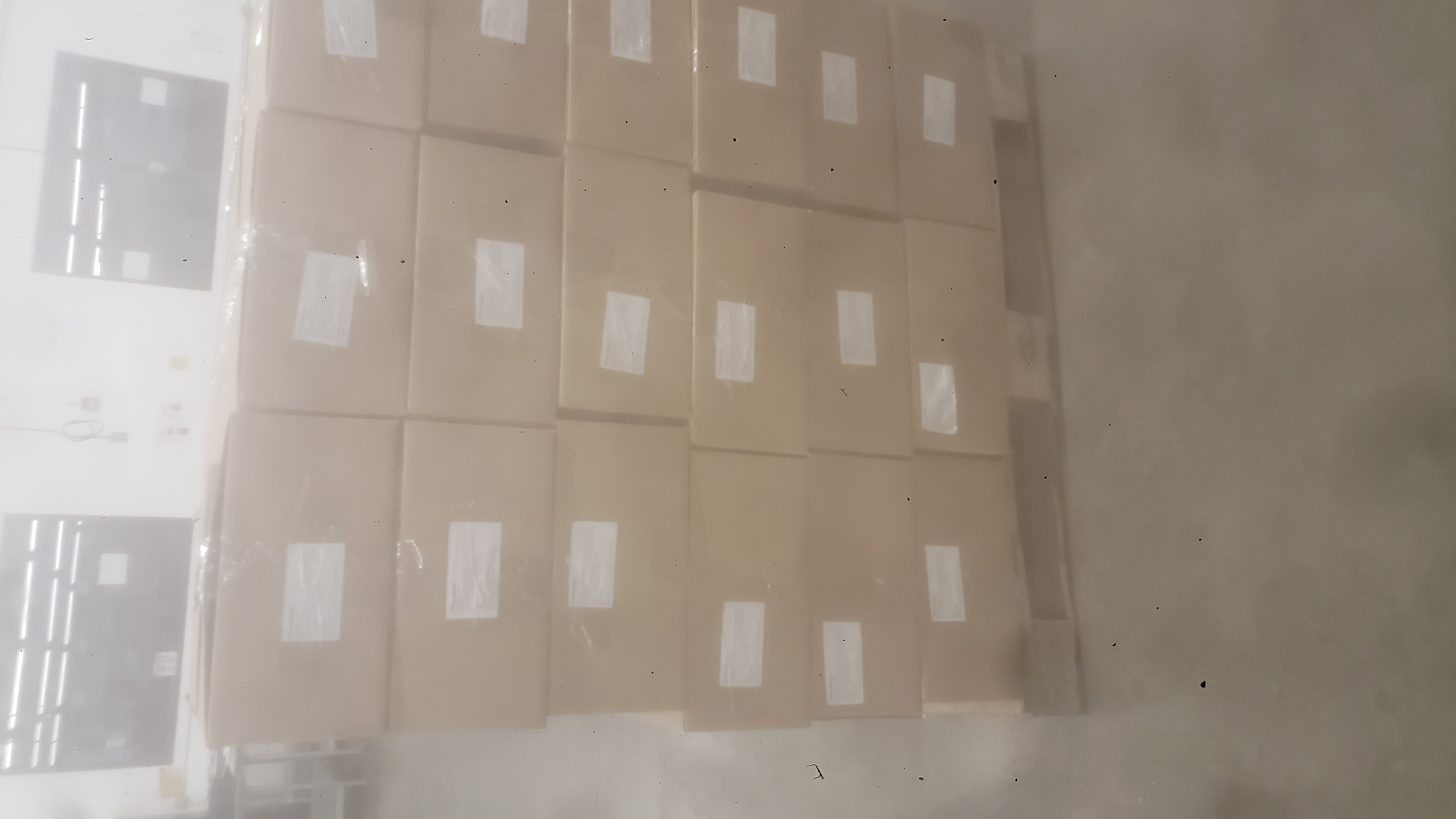 Cardboard box with labels in a pallet.